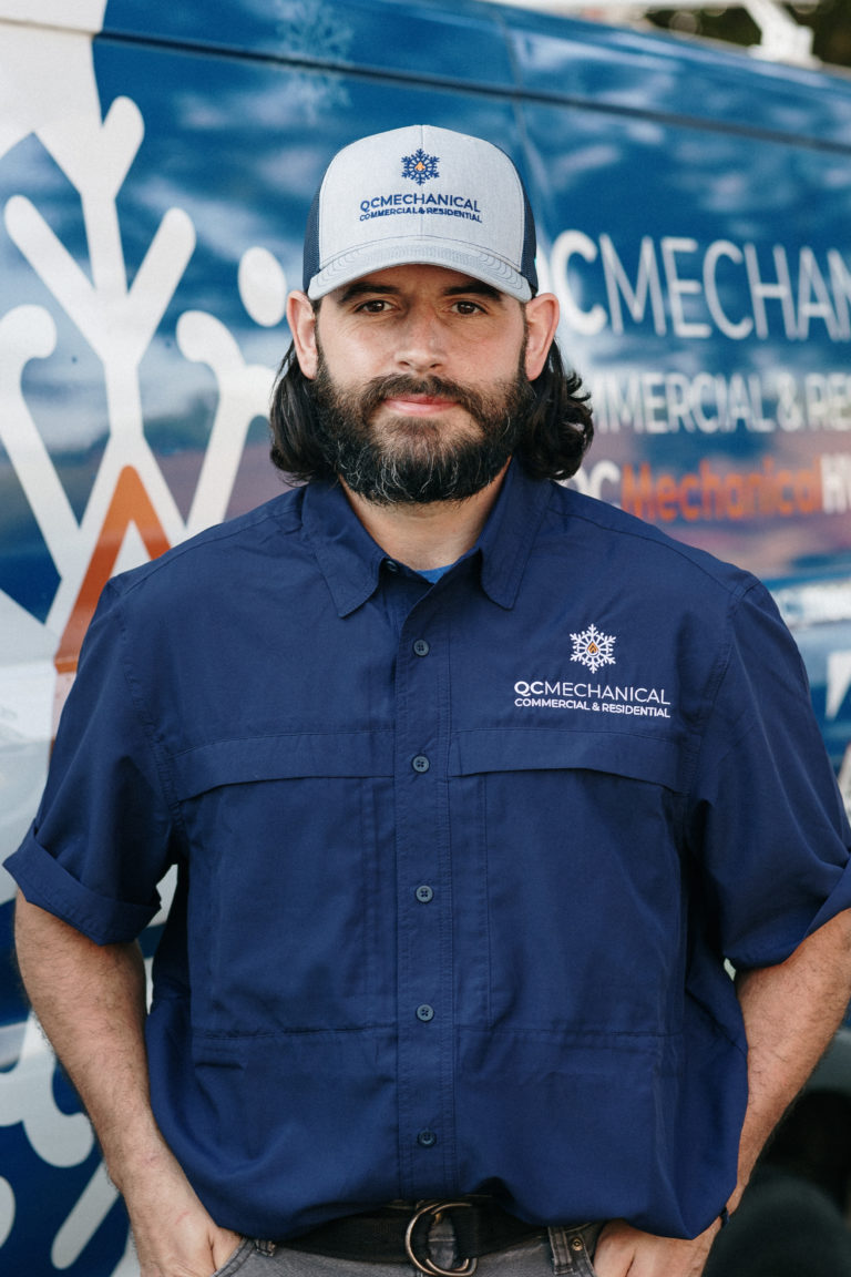 Person wearing a blue shirt and hat with 