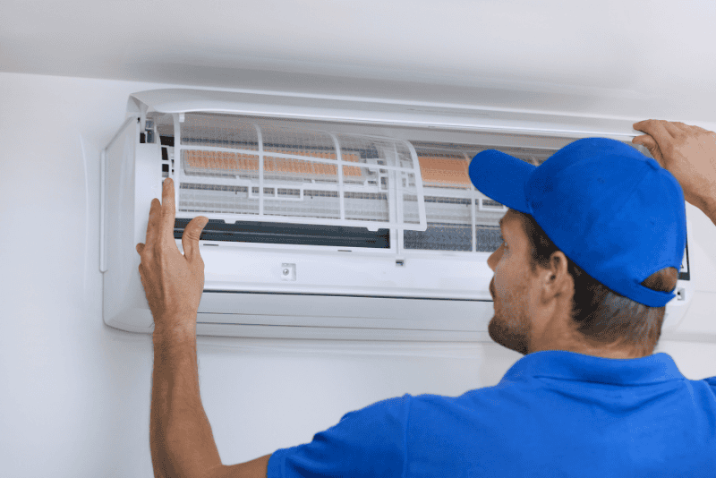 HVAC technician performing an AC maintenance checklist before summer in Charlotte, NC